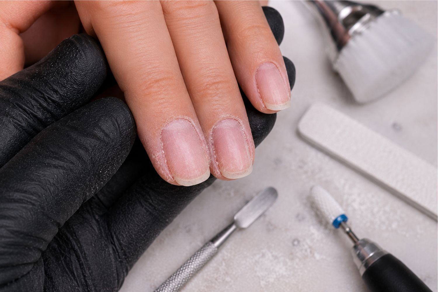 Incomplete nail preparation process that can lead to lifting and poor enhancement results.